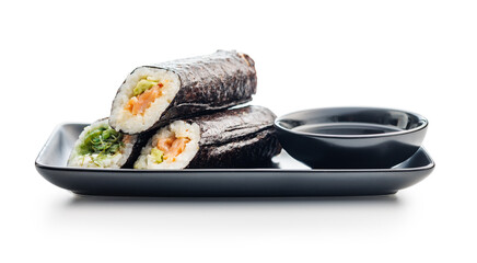 Wall Mural - Sushi Roll on Black Plate With bowl of soy sauce.