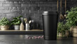 a black plastic tumbler is in the kitchen