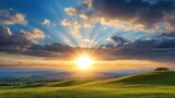 Fototapeta Na sufit - Breathtaking sunset over rolling green hills, radiant sunbeams piercing clouds. Ideal for nature-themed content, wall art, digital backgrounds