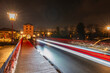 © Westend61 - Germany, Hesse,LimburganderLahn,Vehicle light trails along asphalt road at night