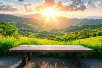 Wall Mural - A wooden table on the background of a green, mountainous landscape against the background of the shining sun.