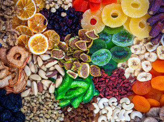 Wall Mural - Mix of nuts and dried fruits isolated on a white background.