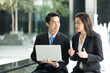 © Image Smith - Asian business people working together on a laptop