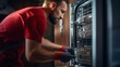 A Side View Young Handyman Repairing Dishwasher, Changing Siphon, Wearing Red Workwear Overalls. Confident Professional Handyman Ar Home ,Focused On Work Alone, In Kitchen.