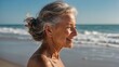 © Amir Bajric - laughing attractive mature senior woman looking away in the coast