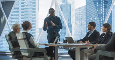 Poster - African American Male Entrepreneur Talks On Board Of Directors Meeting In Corporate Office. Diverse Investors Listening, Discussing With Confident Black Businessman Growth Strategy For Startup.
