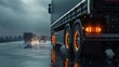 Truck chassis and orange wheels on a wet road in rainy weather, close-up. Safety concept and tire grip on wet road