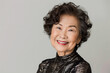 © myboys.me - Portrait of old healthy, cheerful beautiful senior Asian woman smiling and looking at camera with white background. Happy aging society, retirement and senior healthcare concept
