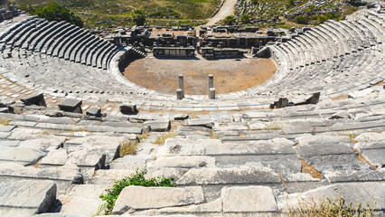 Wall Mural - Theater at Miletus. The grand Miletus Theatre radiates history, its semicircular rows descending to the ancient stage. Milet (Aydin), Turkey (Turkiye)