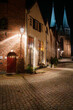 Atmospheric medieval street at night during the blue hour in the city of Deventer with the Bergchurch