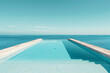 Pool extending to ocean under blue sky with no end in sight