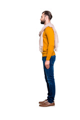 Poster - Full size fullbody snap, side view half face portrait of handsome attractive stylist in sweater, jeans having scarf around neck isolated on grey background