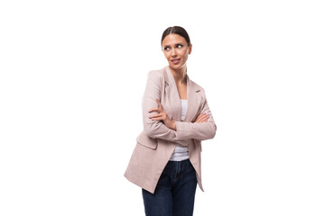 Wall Mural - charming young woman with black hair in a jacket on a white background with copy space