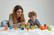 mother and ADHD son playing with blocks