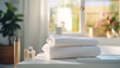 the atmosphere of a pleasant bath, spa treatment at home. towel on a white bathtub in a bright bathroom with beautiful light from the window.
