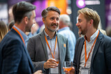 Fototapeta Londyn - delegates networking at a conference drinks reception. Attendees engage in professional interaction and socializing, seizing the opportunity to make relationships