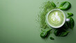 Cup of Matcha latte on the green background, top view 