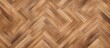 A light brown wood floor featuring a chevron pattern, arranged in a herringbone design. The intricate zigzag pattern adds visual interest and sophistication to the room.