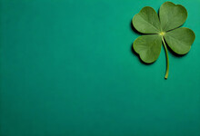 Four Leaf Clover On Green Background St Patrick's Day Concept