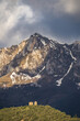 © ADDICTIVE STOCK - Solitary Church Against Snowy Picos de Europa Peaks