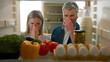 © Yuliia - POV Point of view from inside fridge adult couple feeling bad disgusting unpleasant smell from broken refrigerator spoiled rotten food meal middle-aged man and woman awful smelling stink from freezer