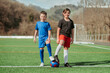 © ADDICTIVE STOCK - Young soccer players standing on field ready to play