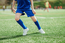 Close-up Of A Soccer Player's Legs On The Field
