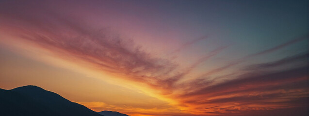 Canvas Print - Mountain Silhouette Against A Vibrant Sunset Sky