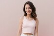 © PNG&Background Image - Happy young American woman wearing a white cropped tank top on a pink background with copy space.