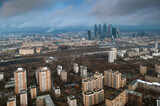 Fototapeta Nowy Jork - Above view of high buildings in neighborhood at spring cloudy day in Moscow
