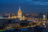 Fototapeta Na sufit - Ukraine hotel and Moscow river with bridge at night in Moscow, Russia