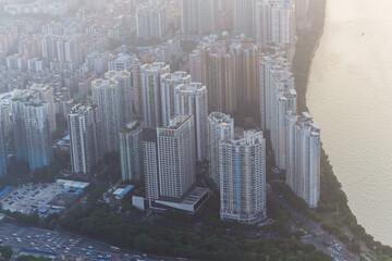 Wall Mural - Guangzhou residential area near Zhujiang river in fog, China