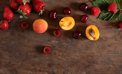 Sticker - assortment of fresh berries on wooden background