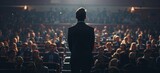 Fototapeta  - A man in business attire stands on stage facing an audience of many people who have come to listen and learn from him Generative AI