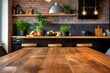 A clean wooden table sits in front of a textured brick wall in a modern kitchen setting.