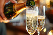 Close-Up Champagne Pouring Celebration. Close-up of champagne pouring into glasses, suitable for festive events.