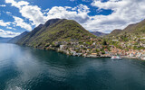 Fototapeta Natura - Aerial view of Argegno, idyllic village on Lake Como