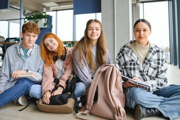 Wall Mural - group of young college students in classroom