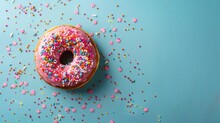 Top View Composition Of Lush Donut With Colorful Sprinkled Icing, On Bright Paper Textured Background With A Lot Of 