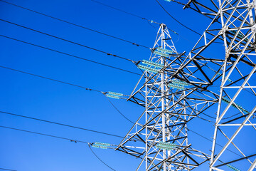 High voltage tower against the sky. Power transmission tower with wires