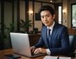 © kineter_ai - Focused Asian Businessman Working on Laptop in Modern Office