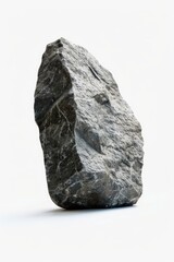 Poster - A large rock resting on a white surface. Perfect for backgrounds or textures.
