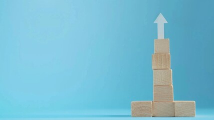 Poster - A stack of wooden blocks with an arrow on top. Perfect for business and direction concepts.