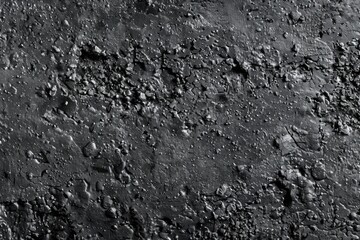 Poster - A black and white photo of a rocky surface, suitable for various design projects.