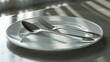 A simple image of a plate with a fork and knife. Suitable for restaurant menus.