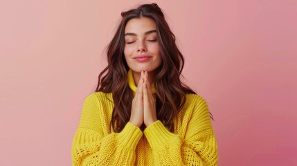 Aufkleber - A woman in a yellow sweater praying. Suitable for religious or spiritual concepts.