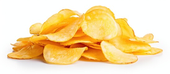 Canvas Print - A pile of potato chips, a popular junk food snack, is displayed on a white background. This staple food ingredient is commonly used in various cuisines as a side dish