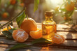 A bottle of aromatherapy essential oil with fresh tangerines