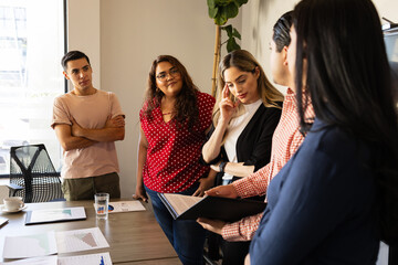 Wall Mural - Plus size businesswoman paying attention during a team meeting