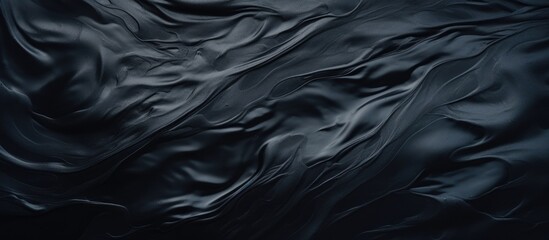 Canvas Print - A close up of a black marble texture resembling a liquid wave, with electric blue patterns flowing through it like wind in darkness. The transparent material looks silky and rocklike